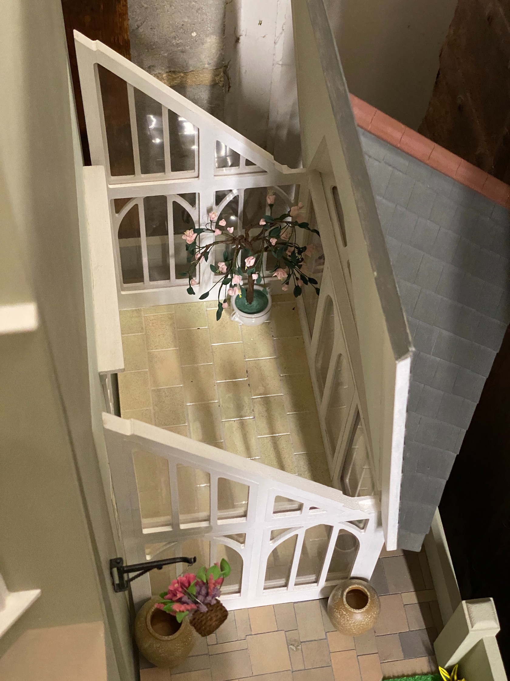 A good quality modern painted wood doll's house, modelled as a Victorian four storey villa, width 76cm, depth 73cm, height 150cm